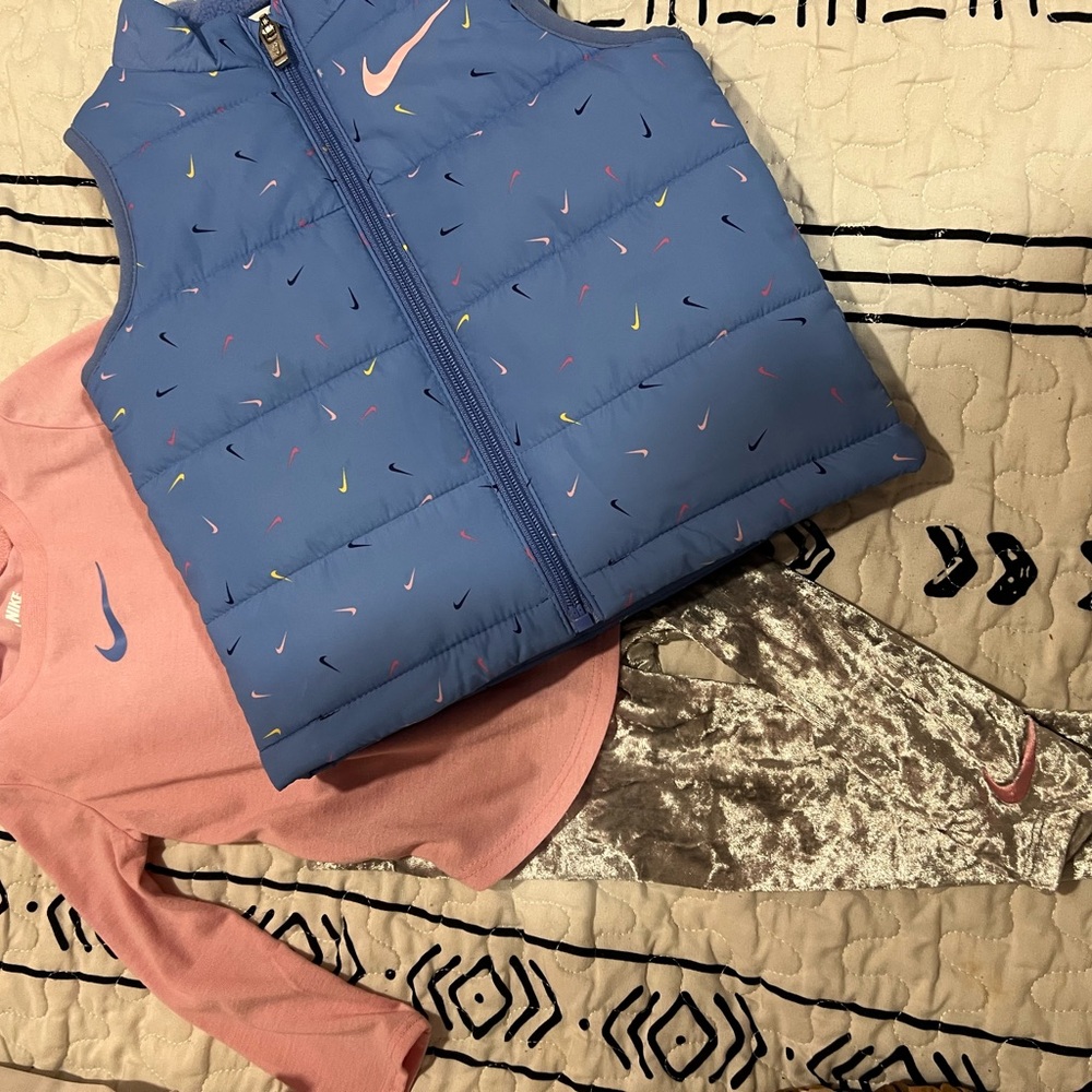 Nike Blue Puffer Vest with Pink Long Sleeve and Gray Leggings